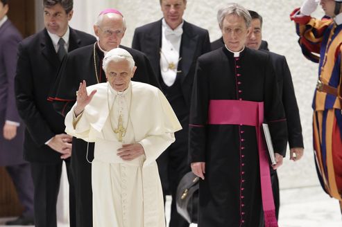 Pope Benedict XVI waves as he arrives to lead a special audience in Paul VI hall at the Vatican